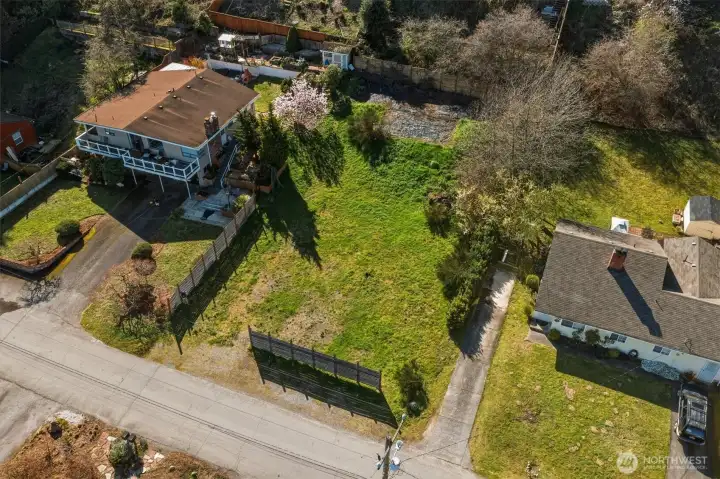 Aerial view of vacant land for sale in South Seattle with surrounding residential neighborhood