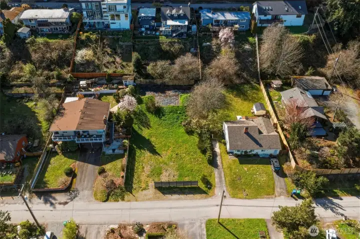 Expansive drone shot showing lot size and neighboring properties
