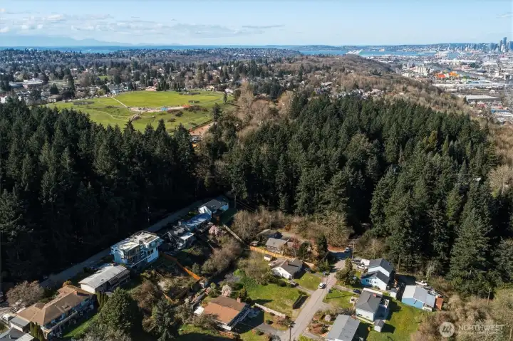 Wide aerial view of buildable lot with easy access to major Seattle roadways