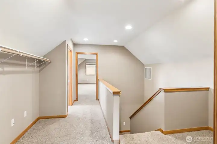 upstairs hall way with gigantic open room