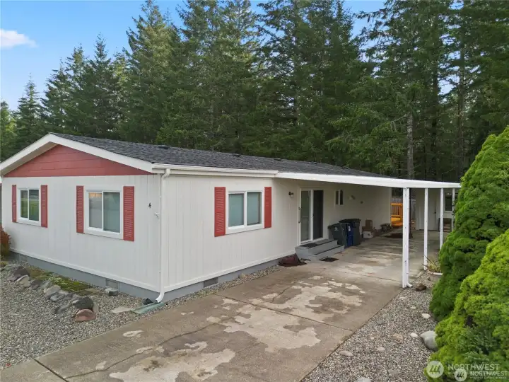 Carport with storage shed at the back.