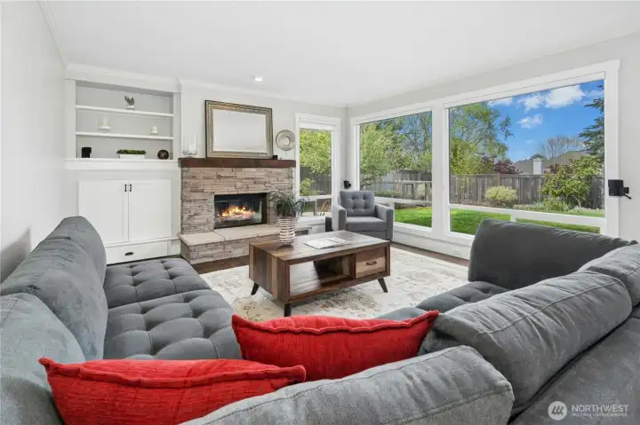 Great Room features updated brick fireplace with built-ins & speakers