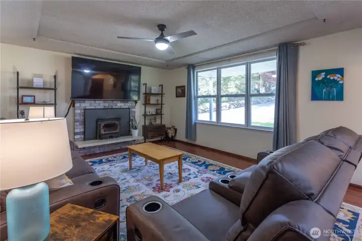 Living room with cozy wood burning fireplace
