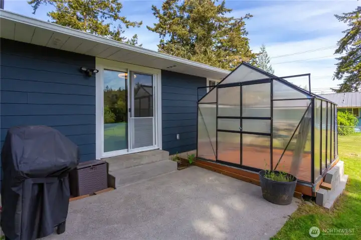 Rear patio & greenhouse
