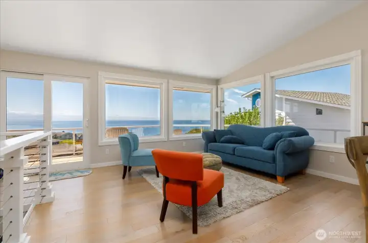 Enjoy the expansive water and Olympic Mountains view from this open concept living space.