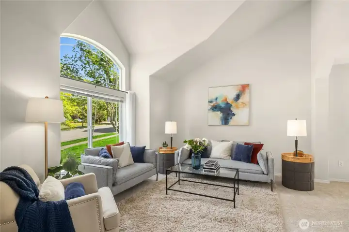 Light & bright living room with vaulted ceilings and oversize windows