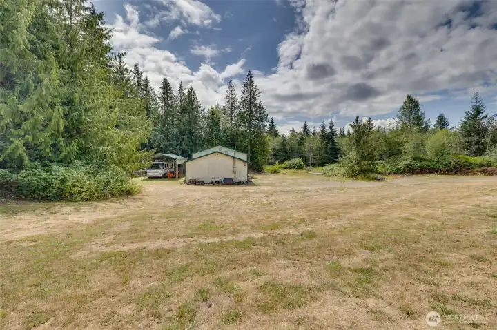 This is another view of the shop with the covered RV parking behind it. You really need to see this home!