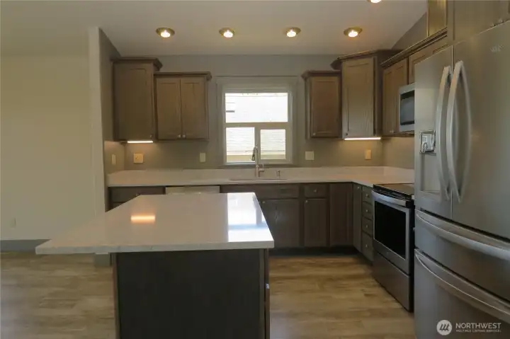 Another view of conteporary kitchen with the luxurious cabinetry, shining quartz counters and like-new appliances! Another view of conteporary kitchen with the luxurious cabinetry, shining quartz counters and like-new appliances!