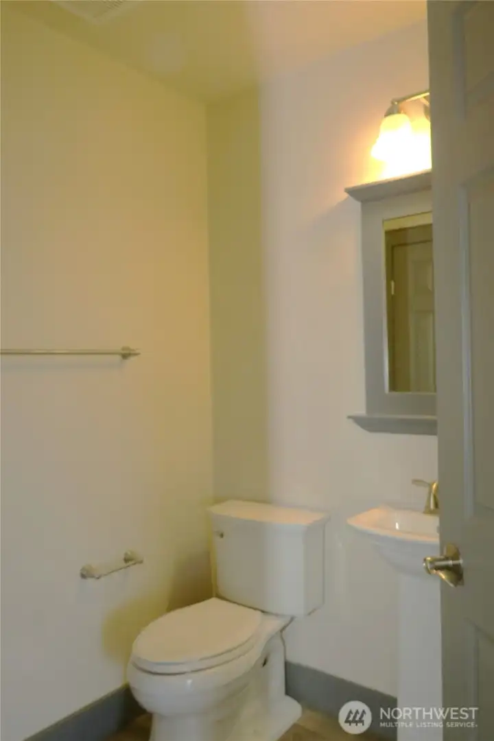 There is a conveniently located powder-room for entertaining guests with ease! There is a conveniently located powder-room for entertaining guests with ease!