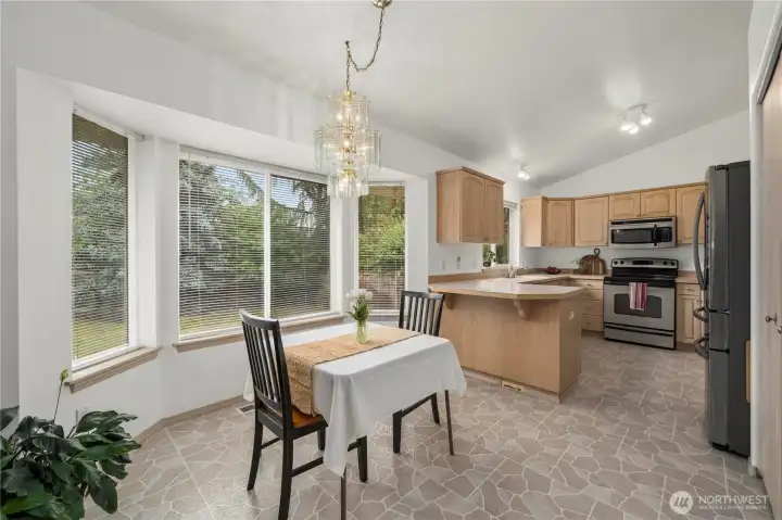Continue from the entry straight into a dining area + kitchen. Continue from the entry straight into a dining area + kitchen.
