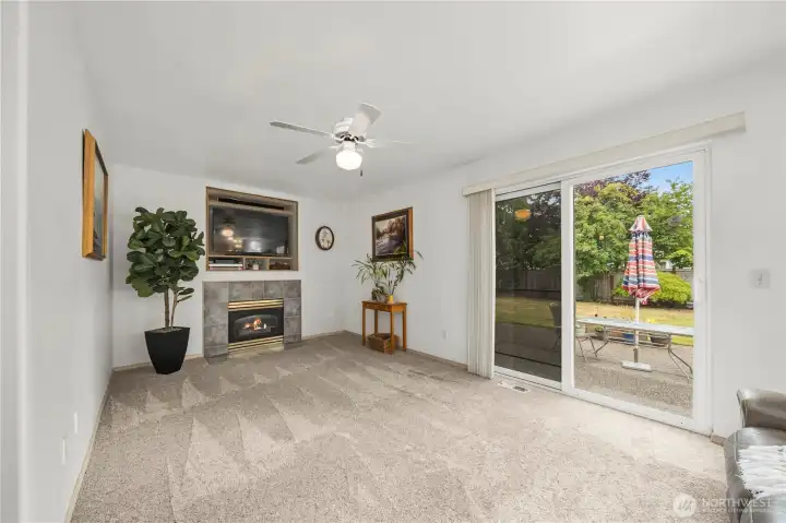 Down a few steps, you'll find a living room with direct access to the backyard. Down a few steps, you'll find a living room with direct access to the backyard.