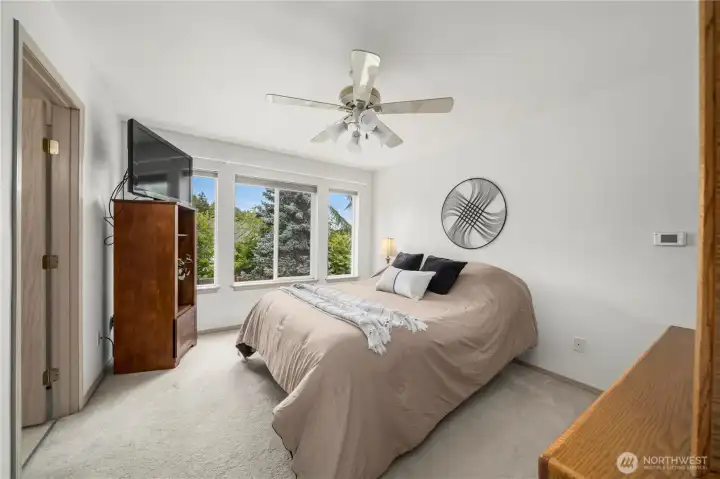 Private primary bedroom located just off the stairs. Private primary bedroom located just off the stairs.