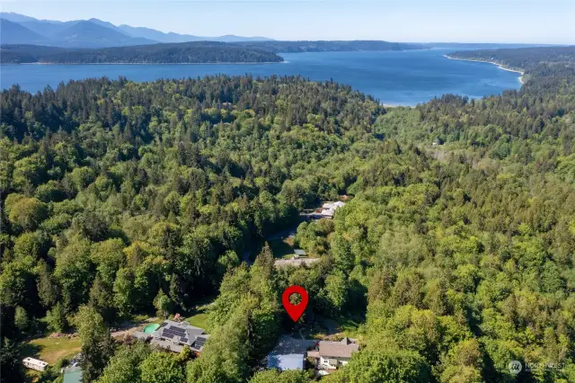 The Hood Canal is visible from several locations inside and outside the home.
