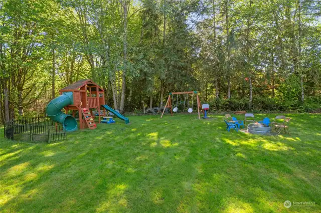 Incredible backyard with a newer playground.