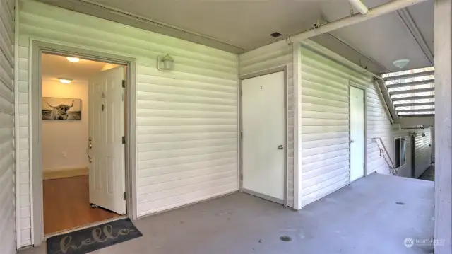 Covered entry with breezeway leading to the unit.