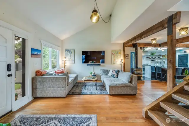 Open Concept Living with Large picture Window and Exposed Beams.