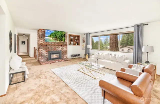 Main floor living room facing gas fireplace