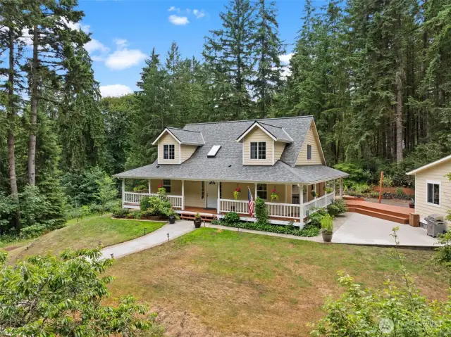 This stunning custom-built craftsman sits on an acre but feels like much more acreage since you are surrounded by trees