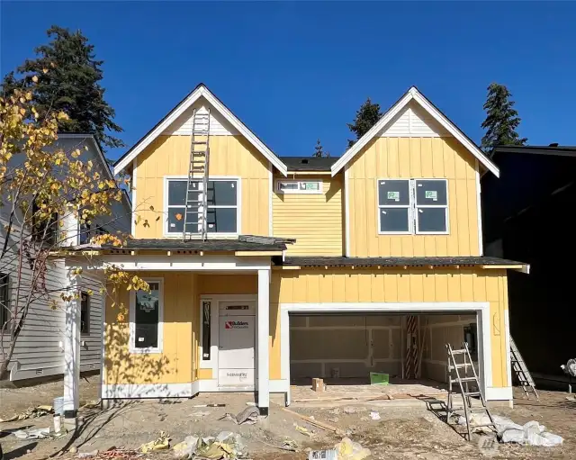 Exterior photo taken 10/24 showing progress on build. All other photos of same home plan built on another lot.