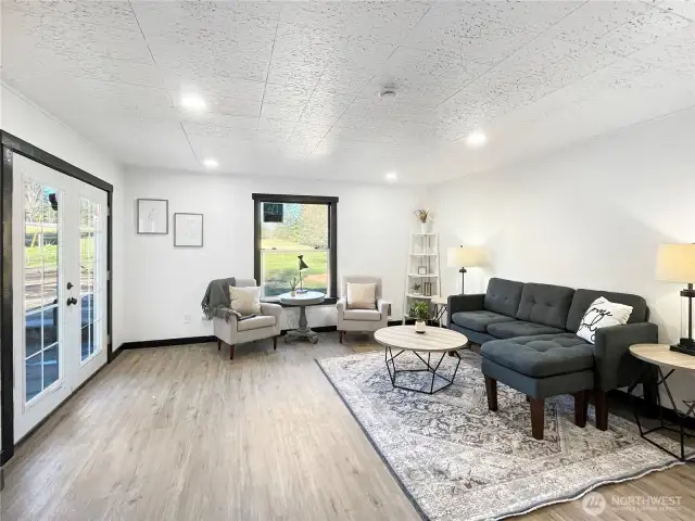 French doors fill the space with natural light and easy indoor-outdoor flow.