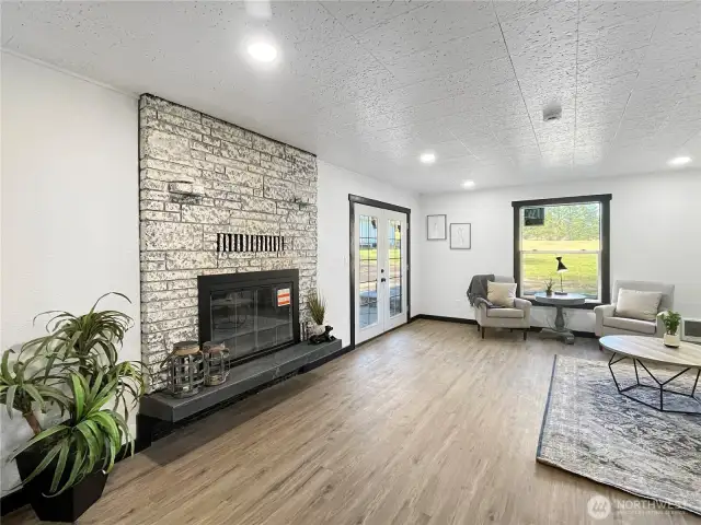 Stylish German Schmear finish updates the brick fireplace, blending rustic and modern charm.