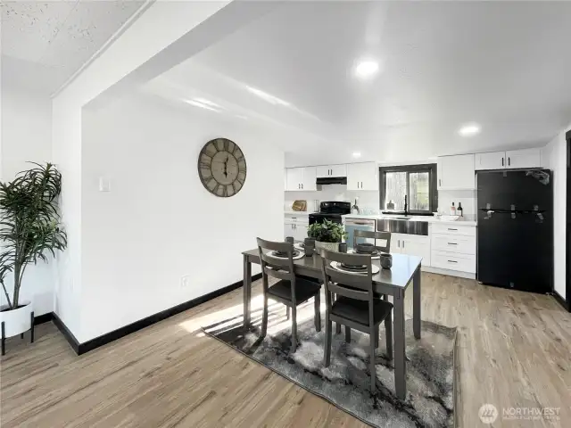 New luxury vinyl plank flooring adds durability and modern style throughout.