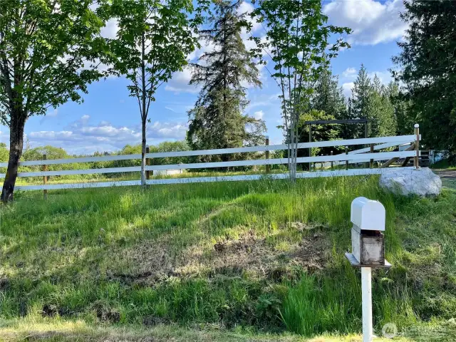 Where home begins: the front fence of 41 E Agate Loop Rd.