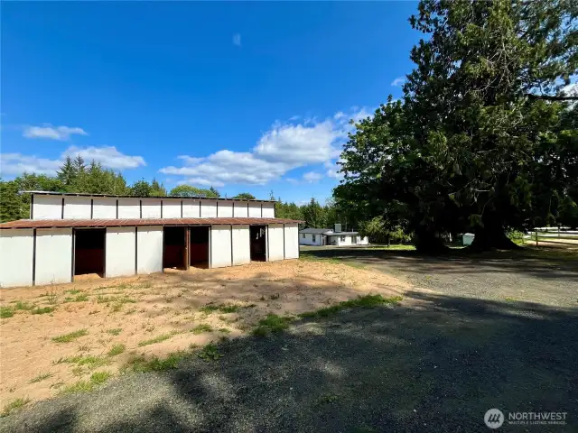 Side view of the barn featuring open stalls—ready for horses, livestock, or storage.