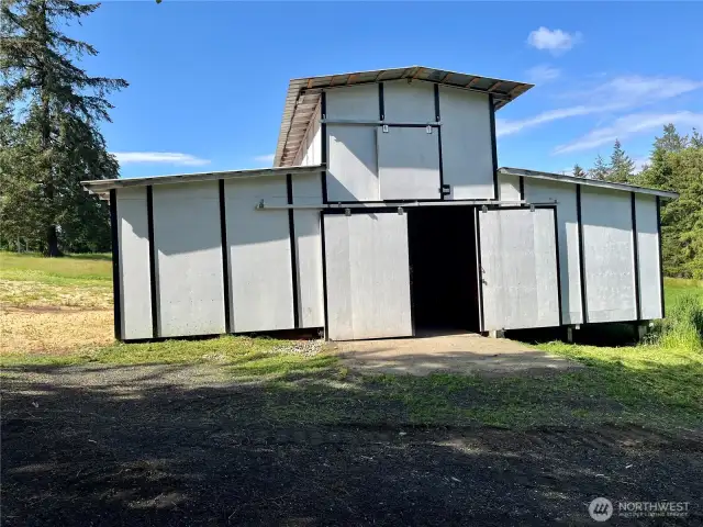 Double sliding barn doors provide convenient entry for animals, gear, or feed.
