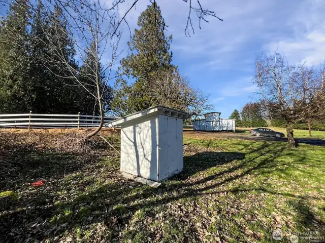 On-site well house provides reliable water access for the home and property.