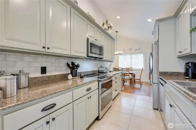 This kitchen has it all with double oven, microwave, and plenty of counter space.