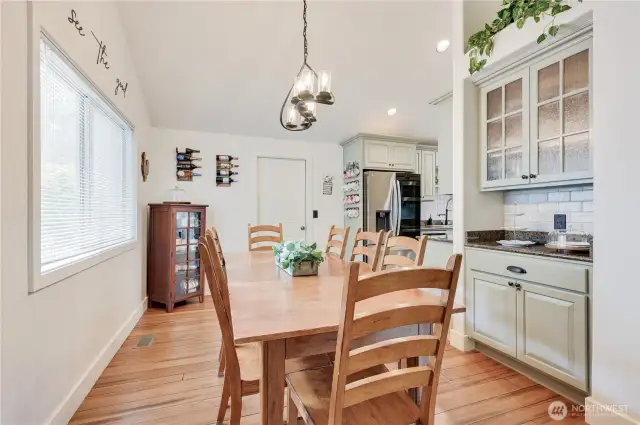 Dining room with extended table and bar nook.