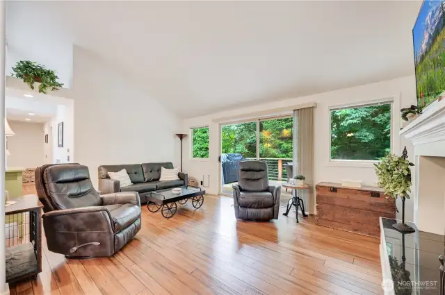 Living room with sliding glass door to deck.