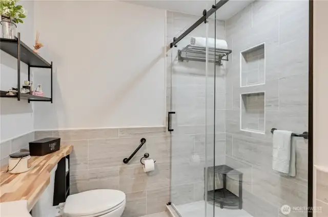 Primary bathroom with step-in shower.