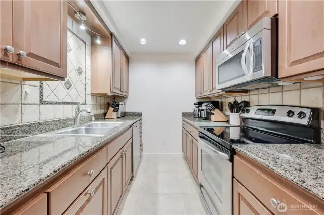 Lower level full kitchen with generous counter space.