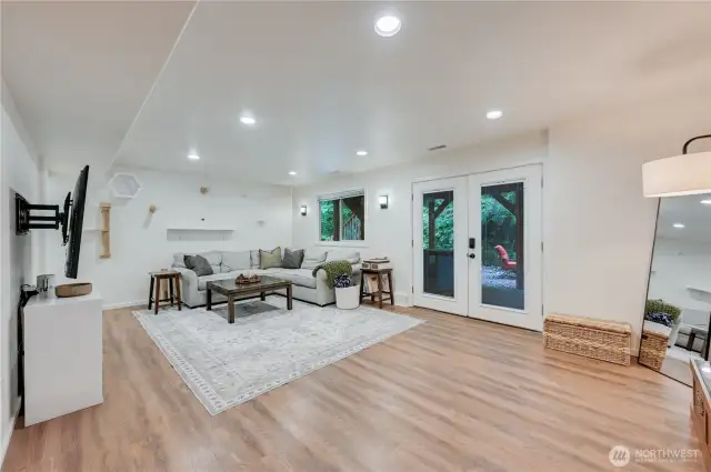 Lower level living space with French doors to fully fenced back yard.