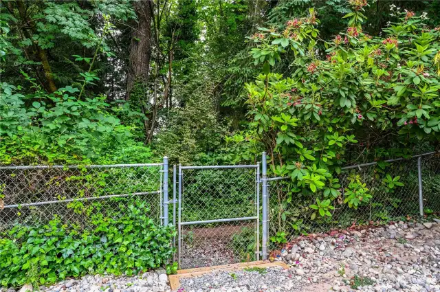 Gate to greenbelt trail to park.