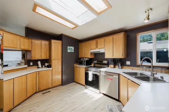 Skylight brings in so much light! Pass-through to the living area so you can be engaged while cooking your specialty!