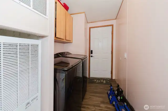 Utility area and the door to the covered car port. Furnace is less than 3 years old!