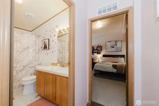 Main bath on the left, Primary bedroom forward