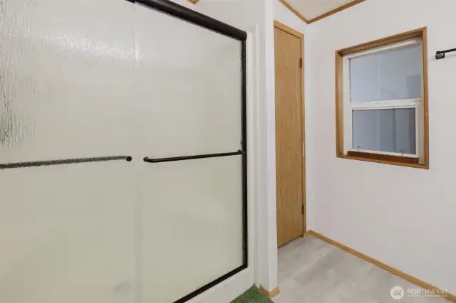 New shower door. Linen closet to the right