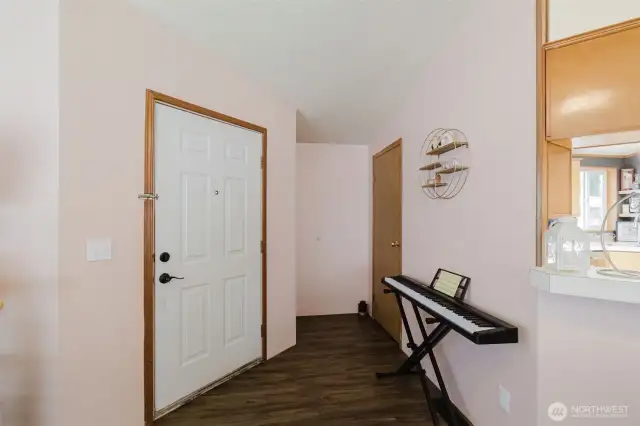 Front door and coat closet to the right