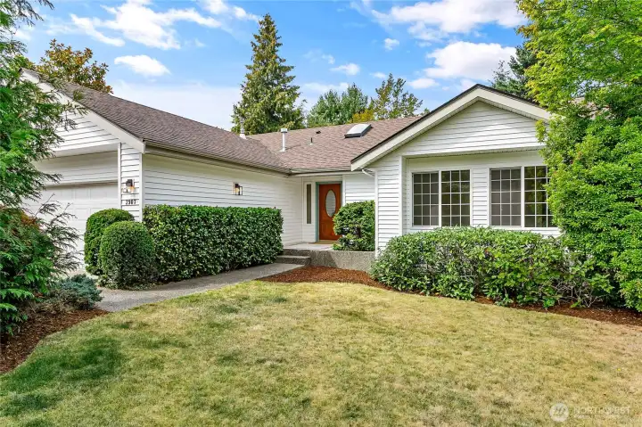 Enjoy full sun in the private landscaped front yard.