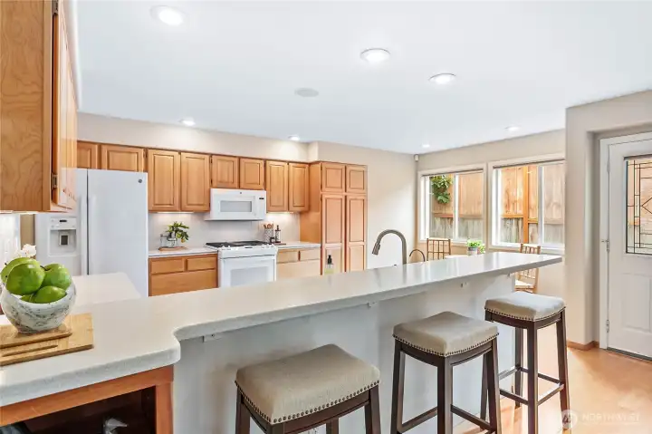 Large breakfast bar making this space very inviting.