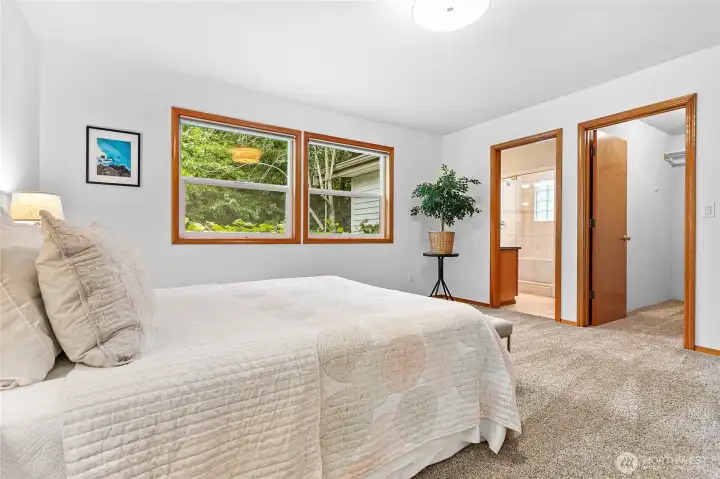 Spacious primary suite with spa like bathroom with jetted tub and steam shower.