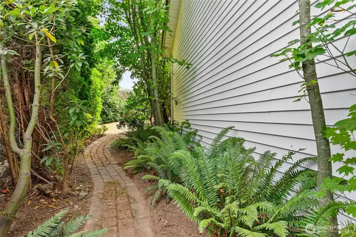 Parklike yard with mature landscaping.
