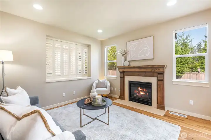 Cozy family room centered around a gas fireplace.