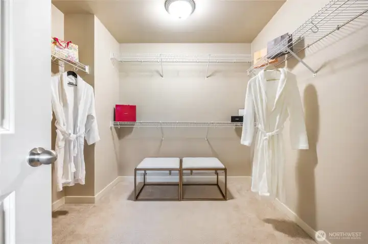Large primary walk-in closet for all your organizing needs.