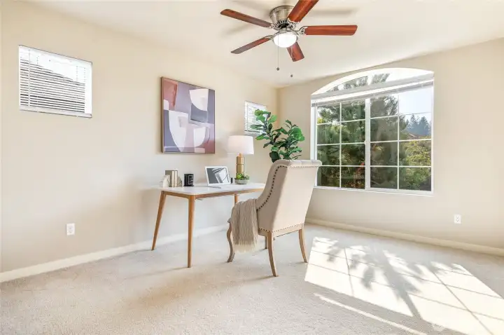Sunlit additional bedroom could be used as an office.