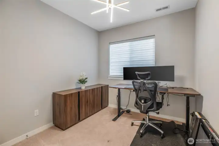 Main floor guest bedroom is currently being used as an office.